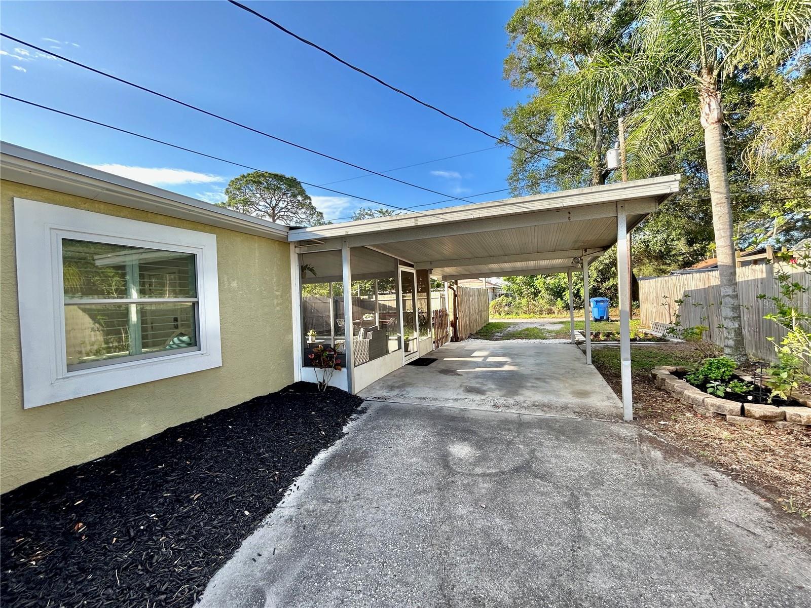 Carport - big enough for 2 cars.