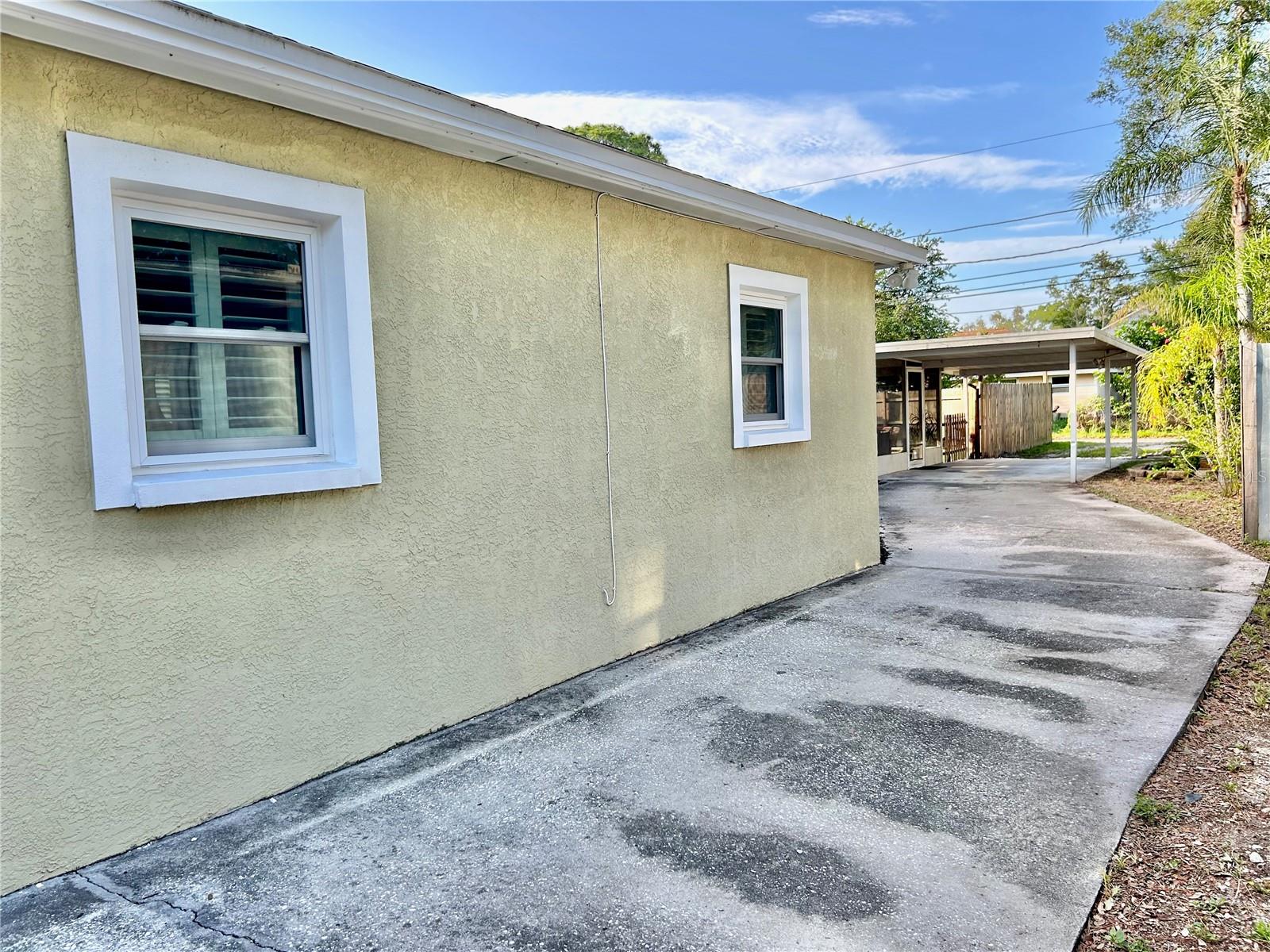 Abundant parking on driveway that extends from street to alley!