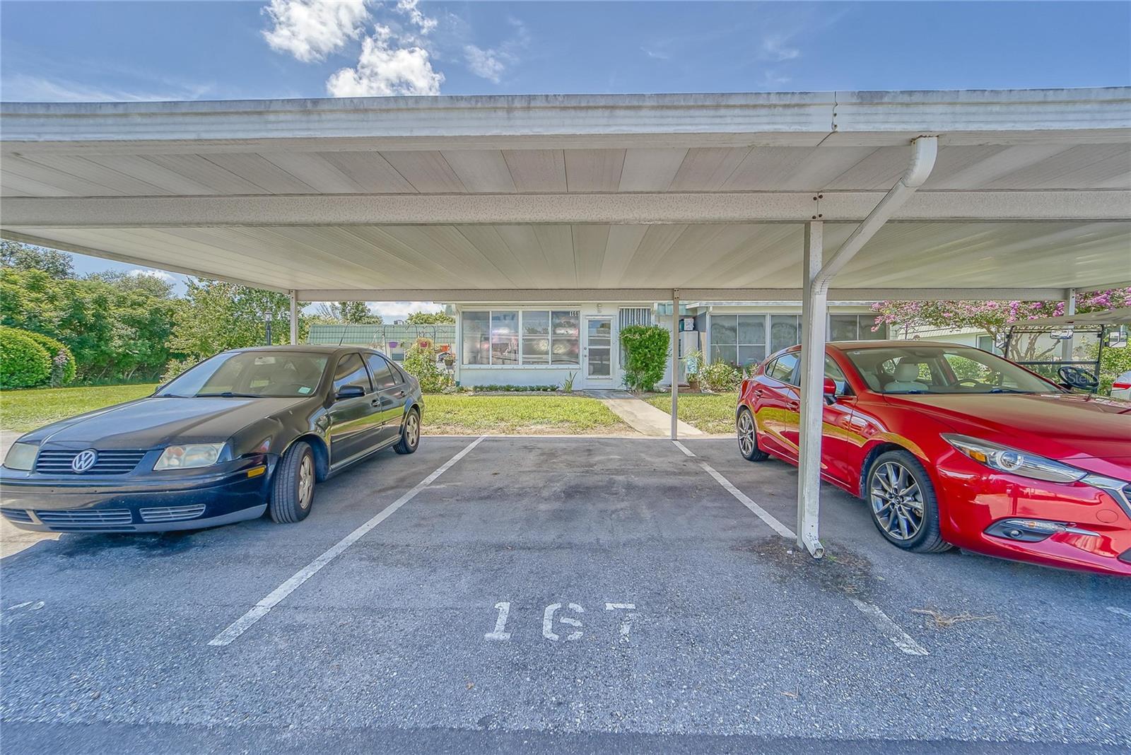 Your covered parking space is steps from your lanai