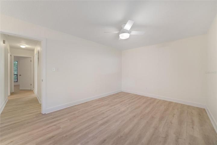 Primary bedroom with ceiling fan