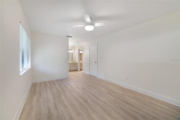 Primary bedroom with view on en-suite bath and walk-in closet