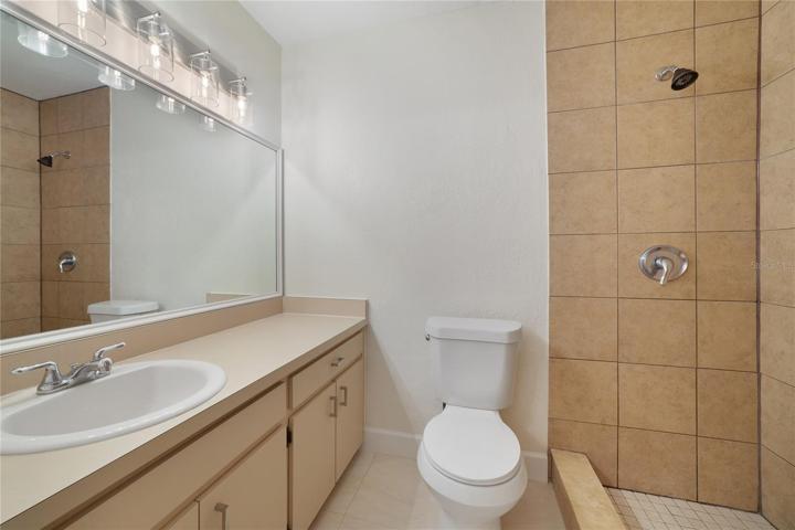 Primary bathroom with shower and second vanity