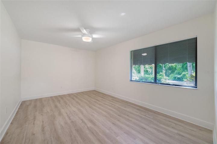 Primary bedroom with window to front yard