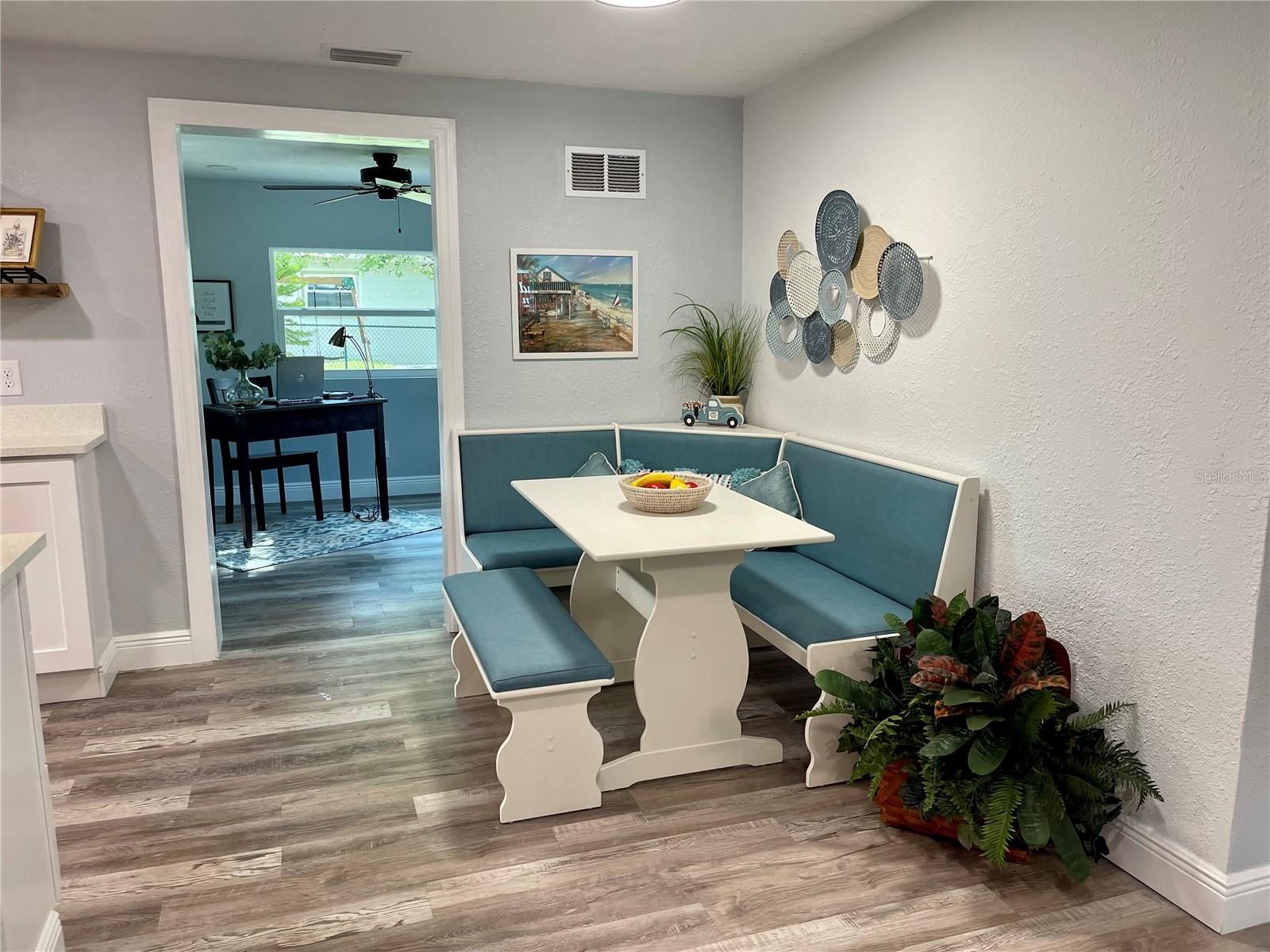 Banquette in the eat-in kitchen, bonus room/office is straight ahead