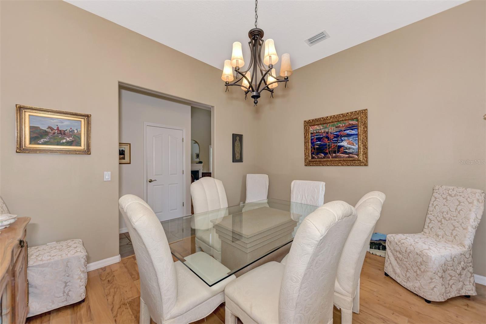 Beautiful Wood Floors in Dining with Chandelier