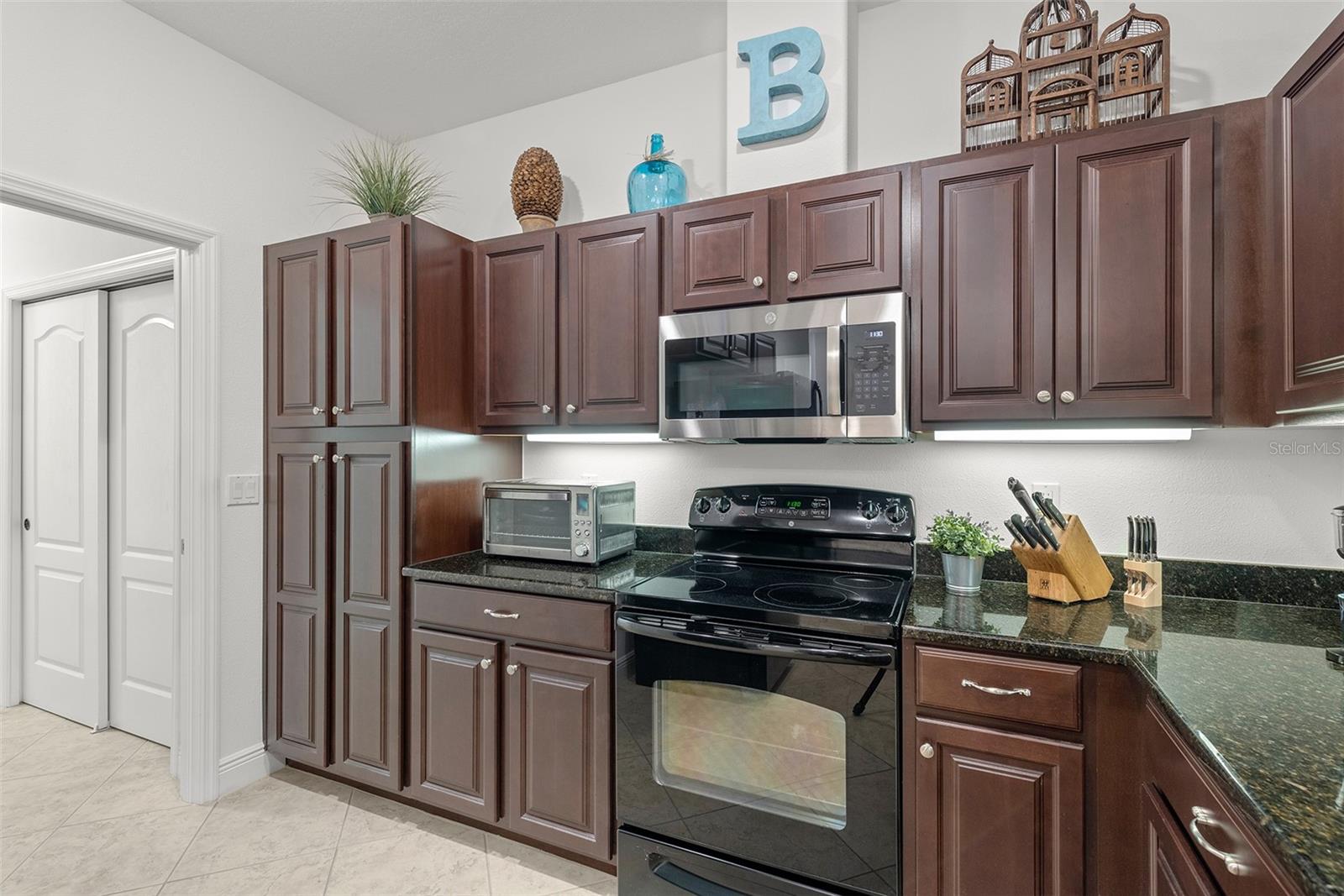 Built-in pantry PLUS extra closet in adjacent Laundry Room