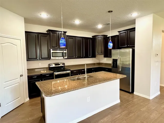 Solid raised-panel cabinets and quartz counters