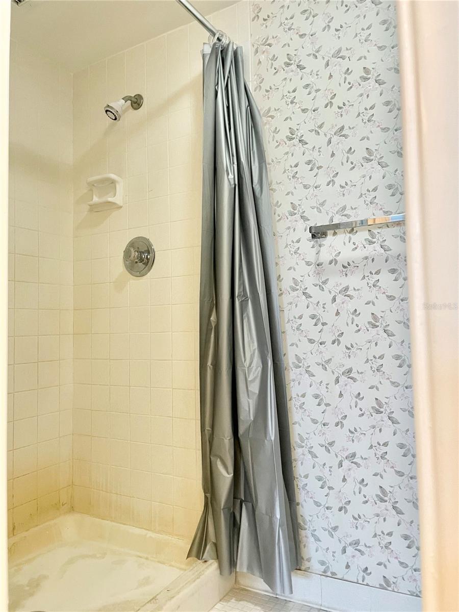 Walk in shower in Owners Suite Bathroom - Commode /shower room with pocket door for privacy, separated from Vanity/dressing area/walk in-closet.