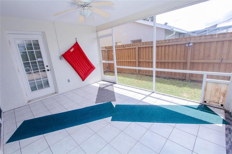 Enclosed Covered Patio leading to pool