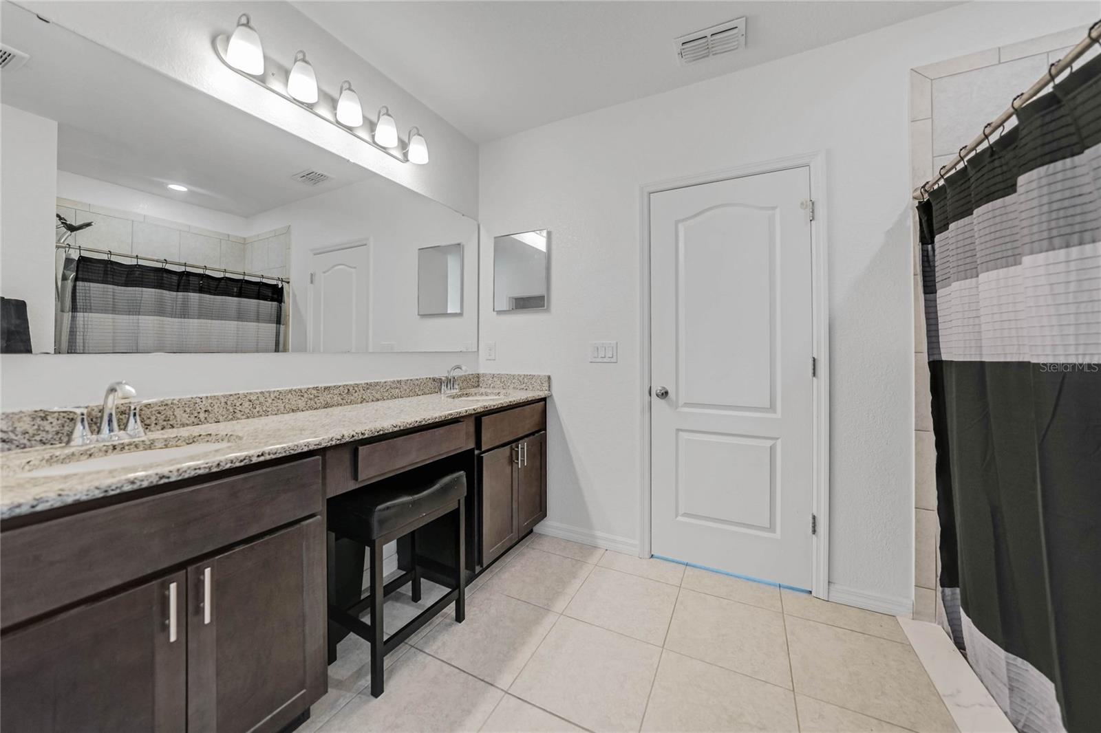 Master bathroom has tile shower.