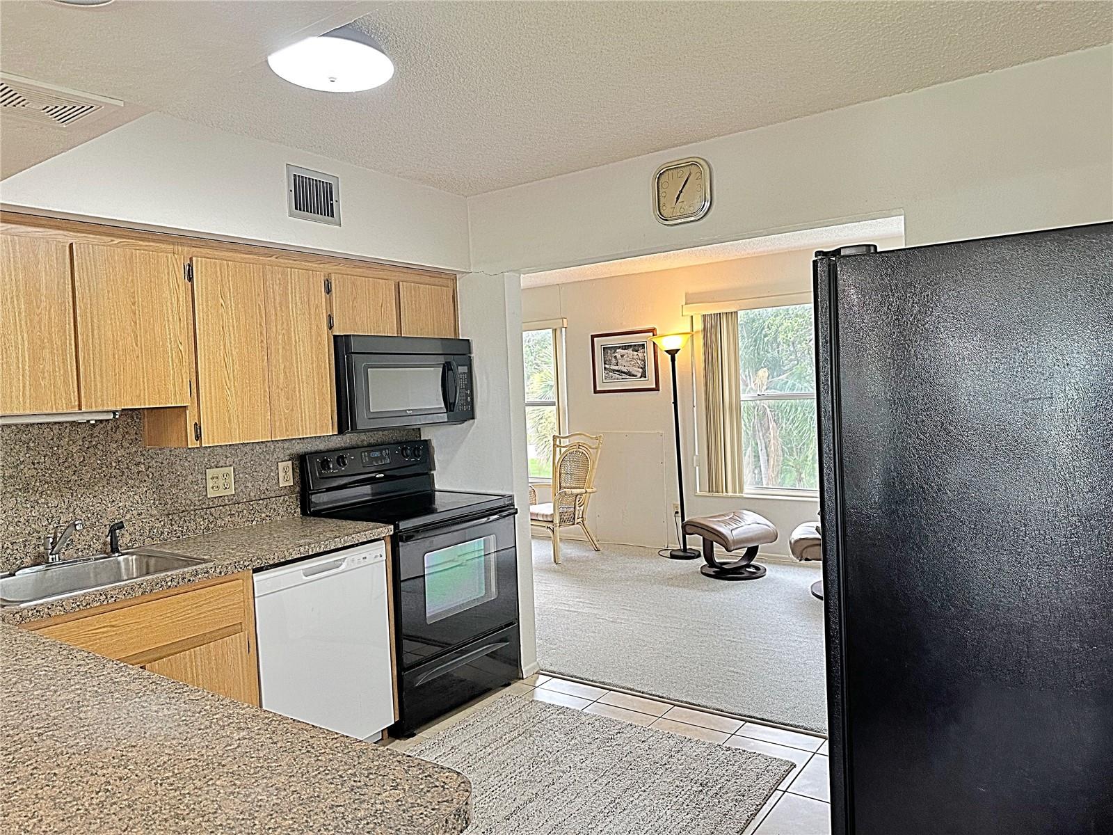 kitchen leading to bonus room