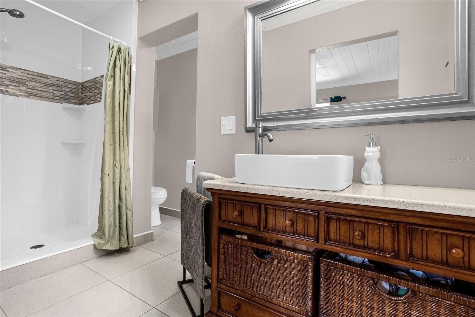 Ensuite bathroom with walkthrough to the master closet.