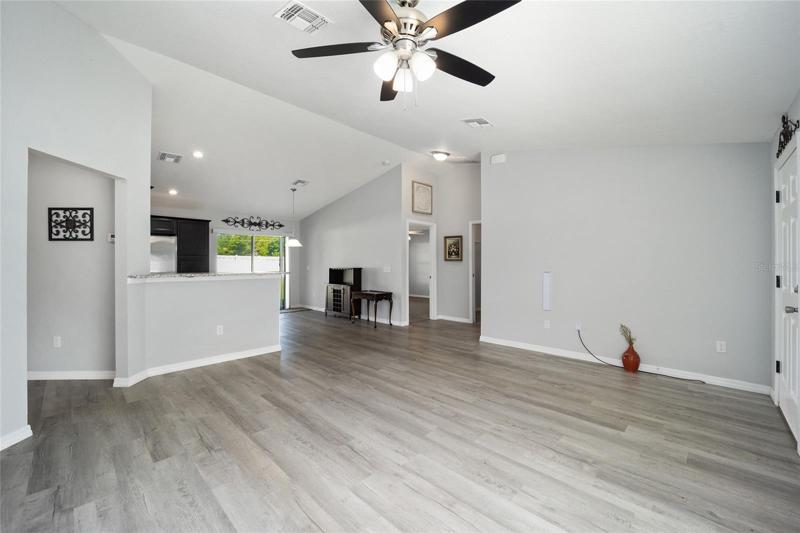 Living area towards kitchen and dining