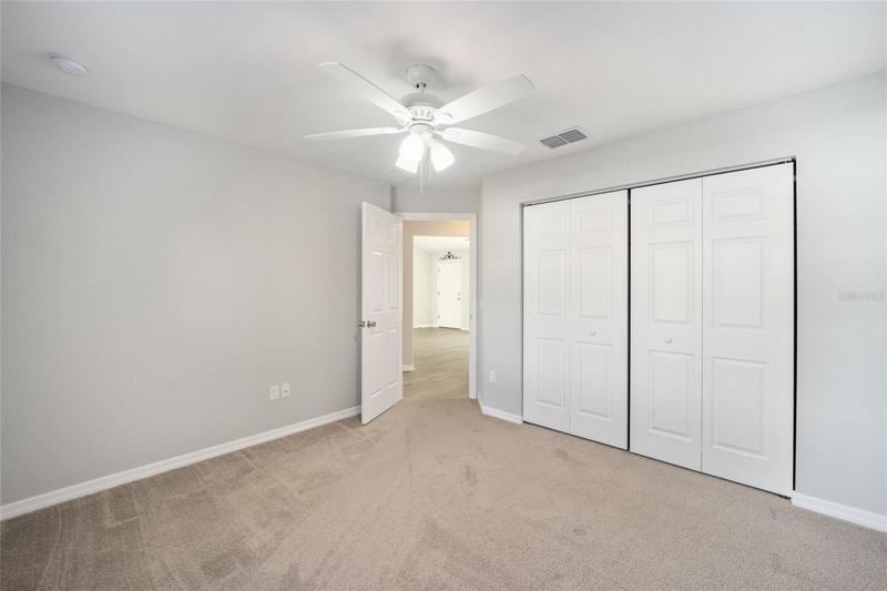 Guest BR with ceiling fan.blinds
