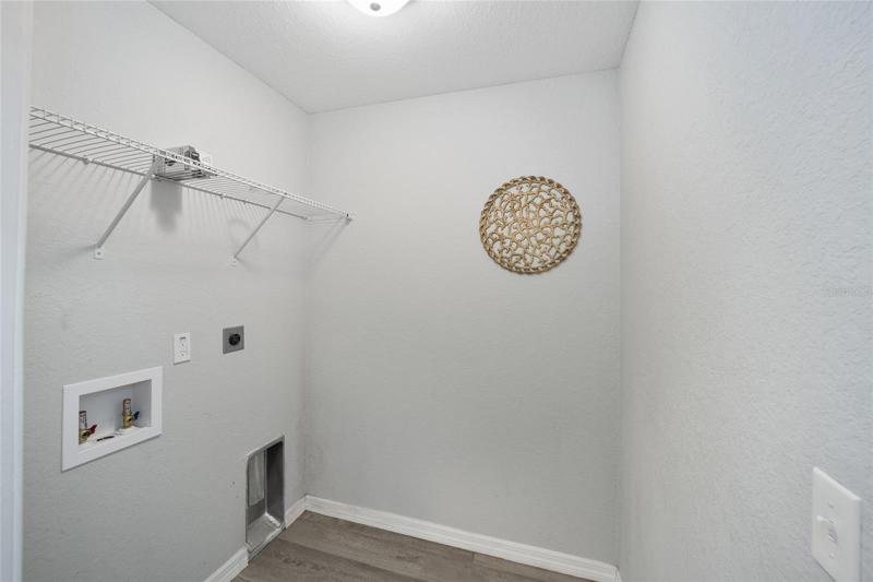 inside laundry with shelving