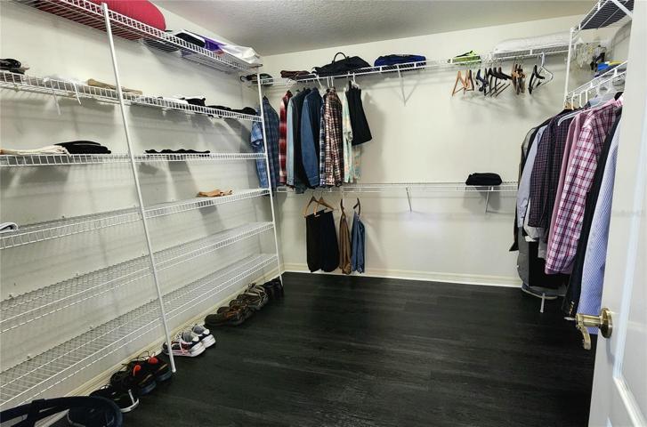 Expansive walk-in closet in owners' suite