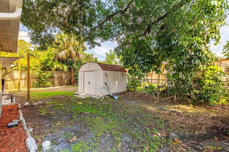 Back yard has storage shed