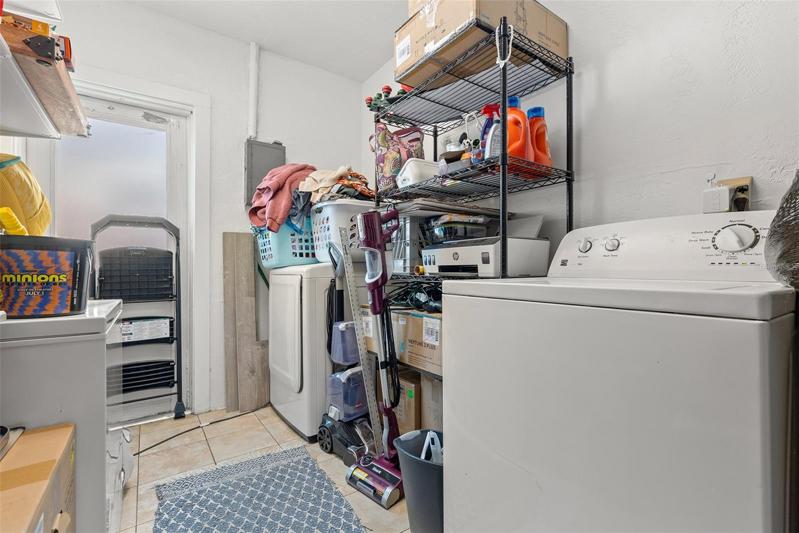 Utility Room with storage space and washer and dryer