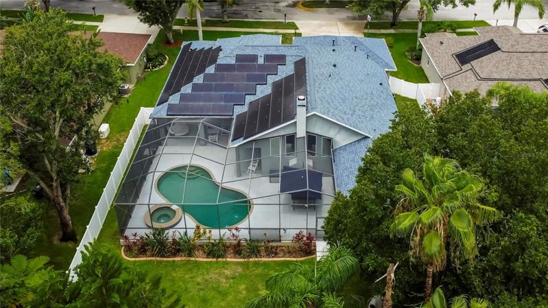Aerial view of home with solar panels
