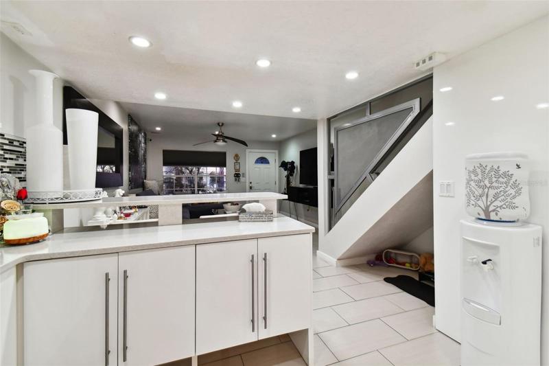 CUSTOM MODERN STAIR RAIL WITH UNDER STAIR PET STORAGE SPACE
