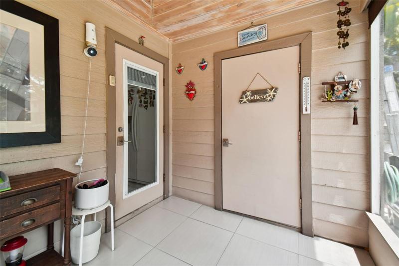 SCREENED BACK PATIO & WASHER DRYER ROOM