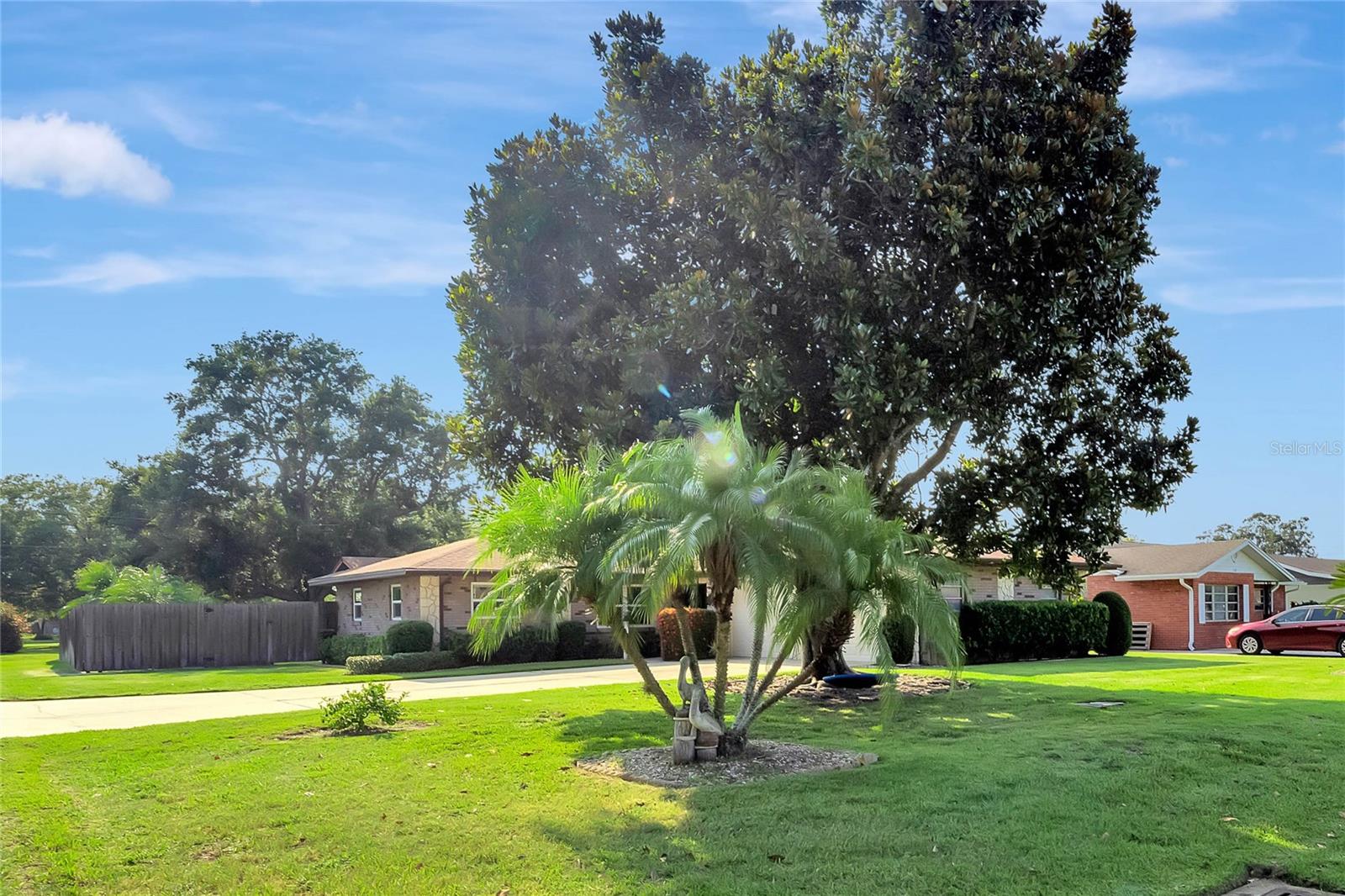 Exterior front oversized driveway. Corner lot