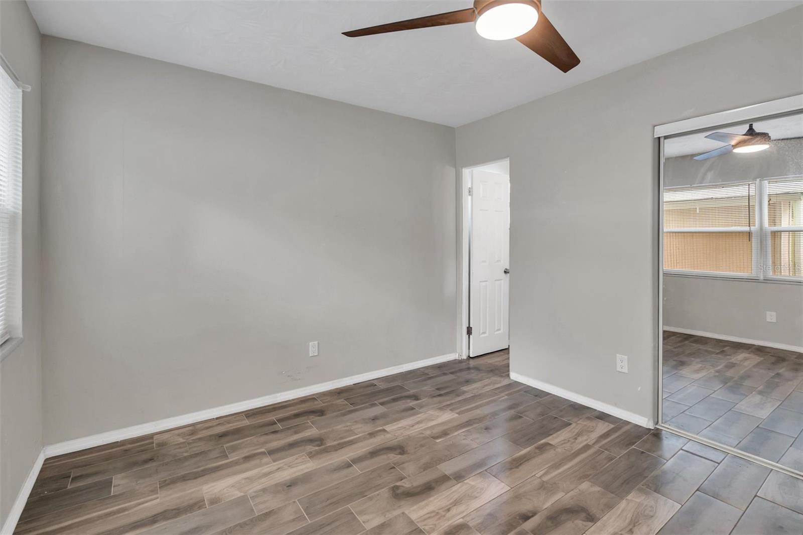 Primary bedroom with new ceiling fan