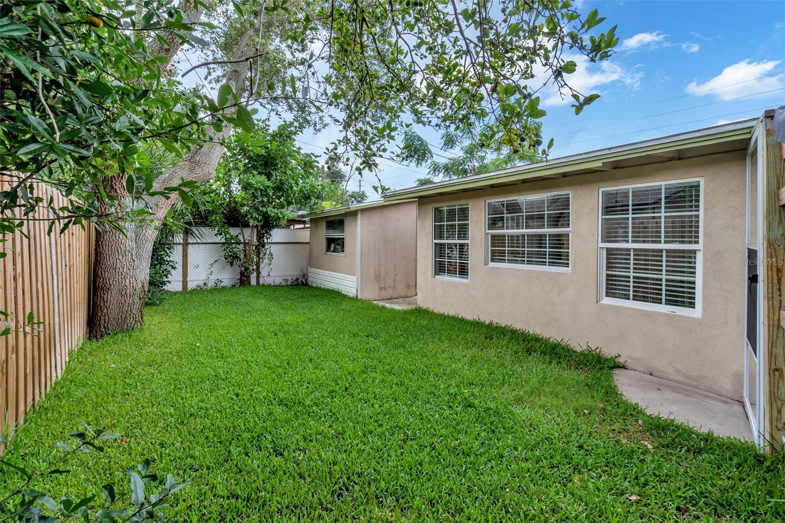 Lush backyard with large storage shed