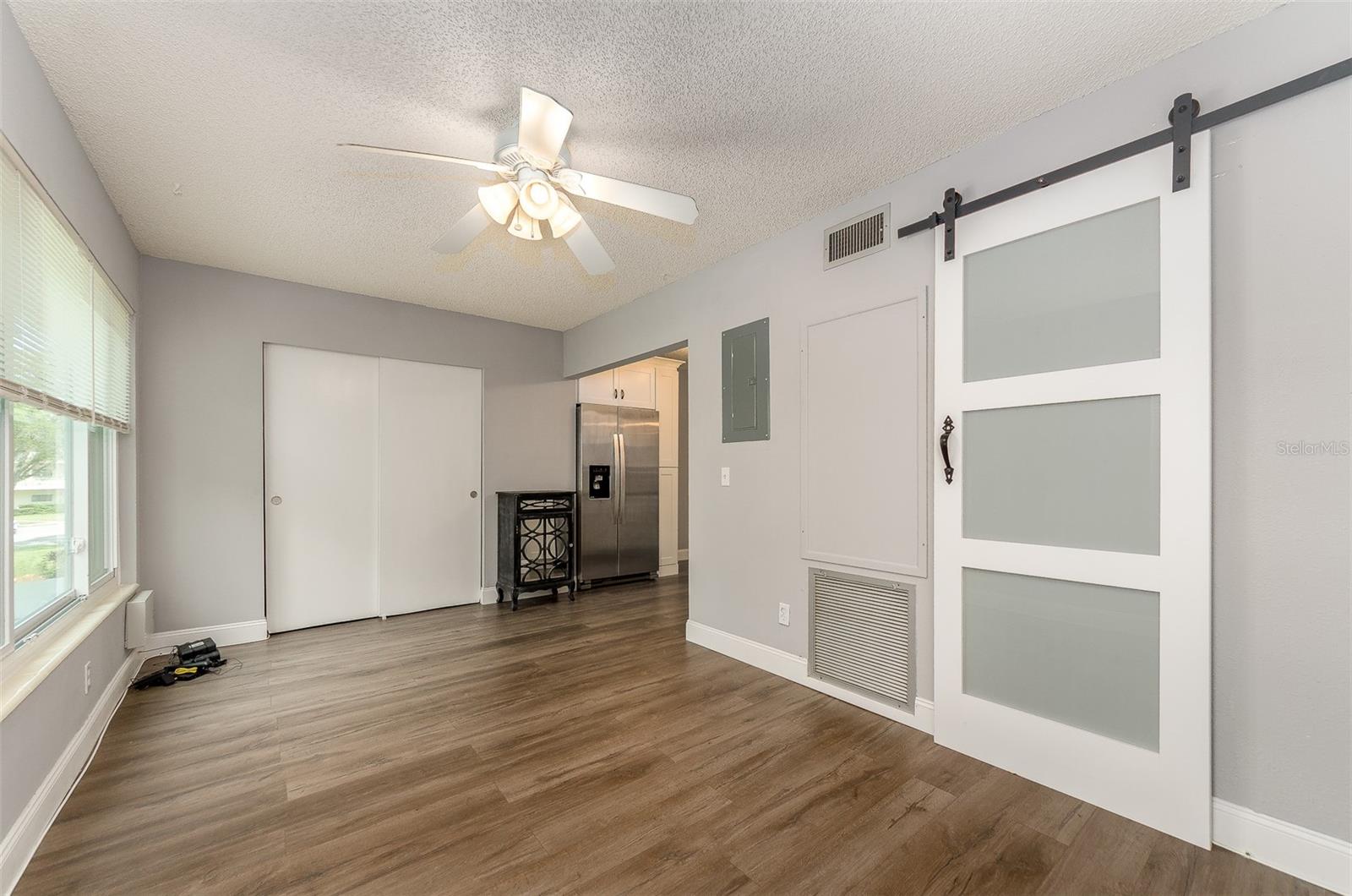 Barn door separates the bonus room from master suite
