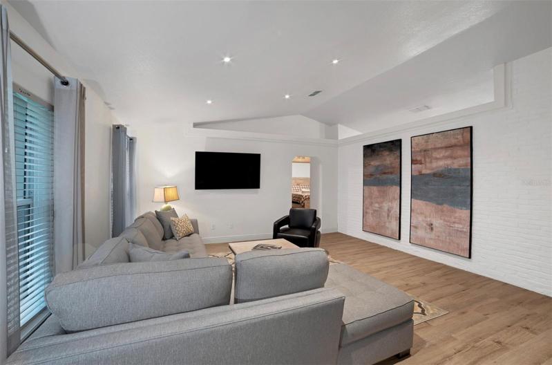 brick accent wall in living room