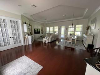 Open flor plan - kitchen overlooking living and dining room to expansive lanai