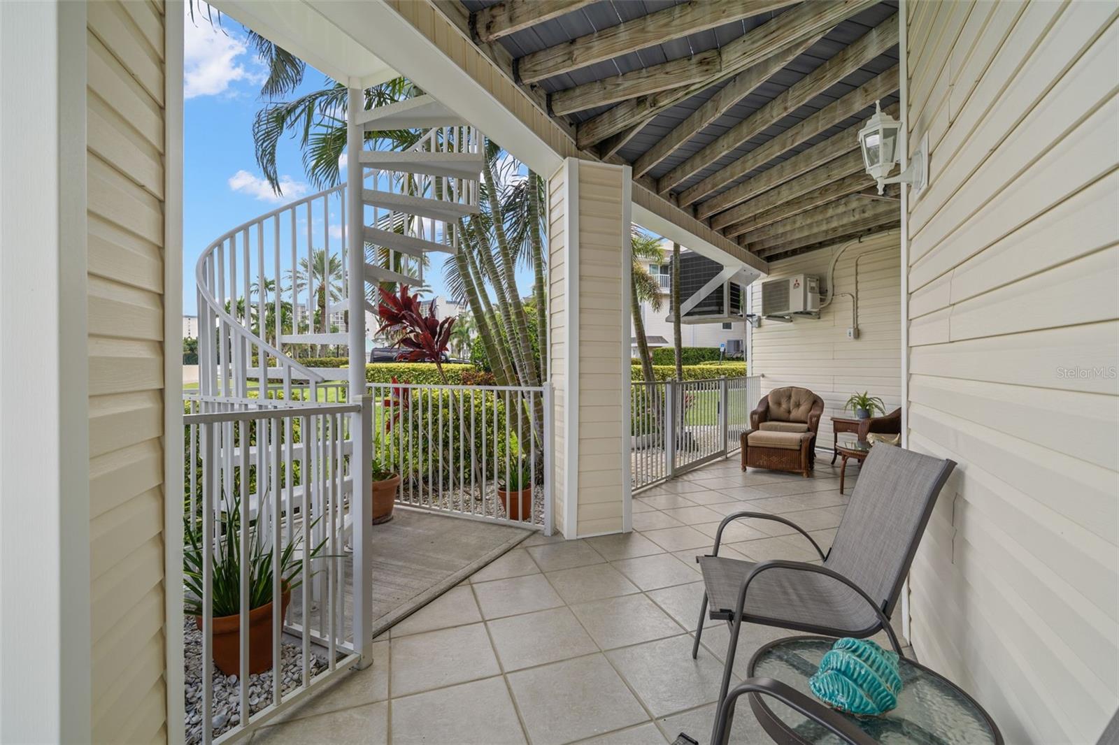 Covered Lanai on First Level. Spiral Stairs to Main Living Level
