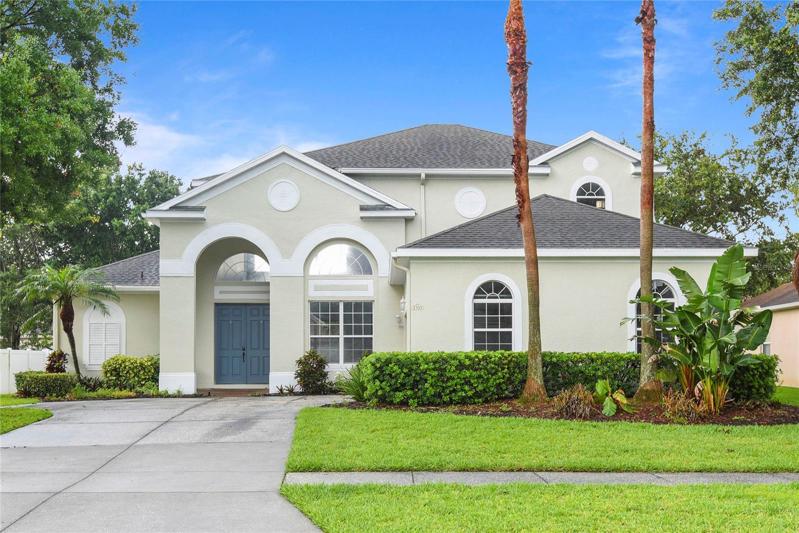 double door entrance with mature landscaping