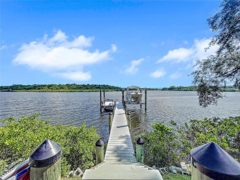 New composite decked dock and 14,000lb boat lift, Killer Dock fish cleaning table, water and electric.