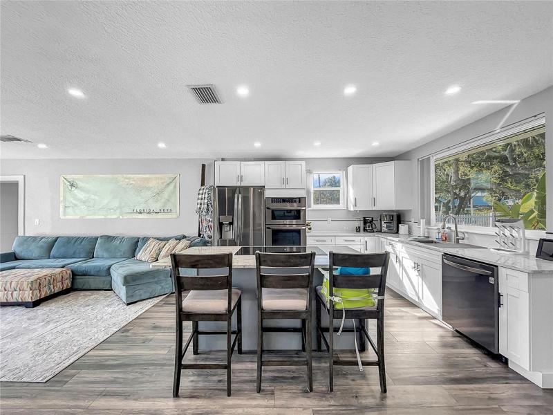 New Kitchen open to Living Room, new LG Black Stainless Appliances, granite countertops.