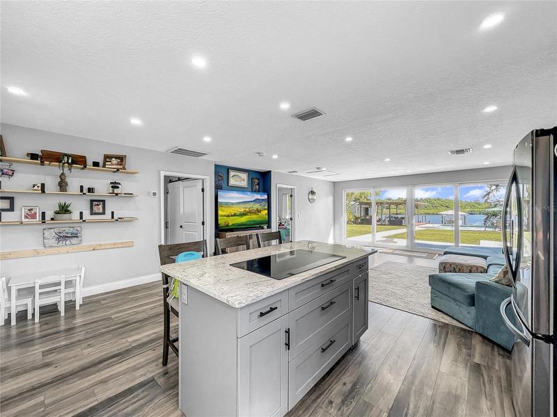 New Kitchen open to Living Room, new LG Black Stainless Appliances, granite countertops.