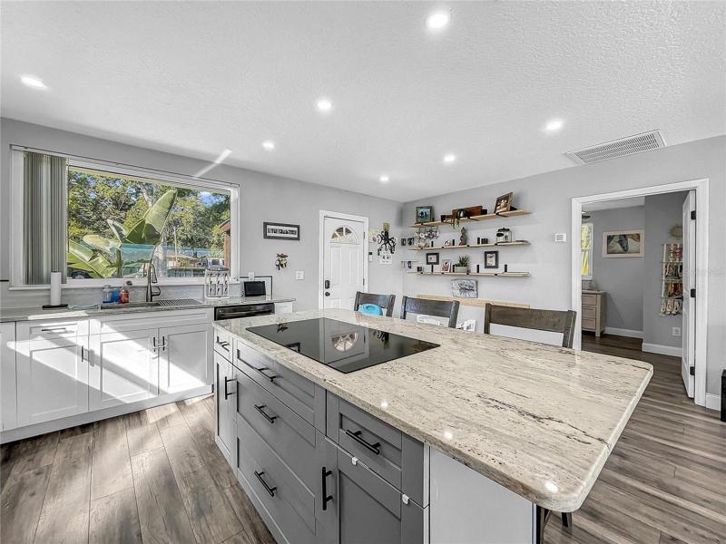 New Kitchen open to Living Room, new LG Black Stainless Appliances, granite countertops.