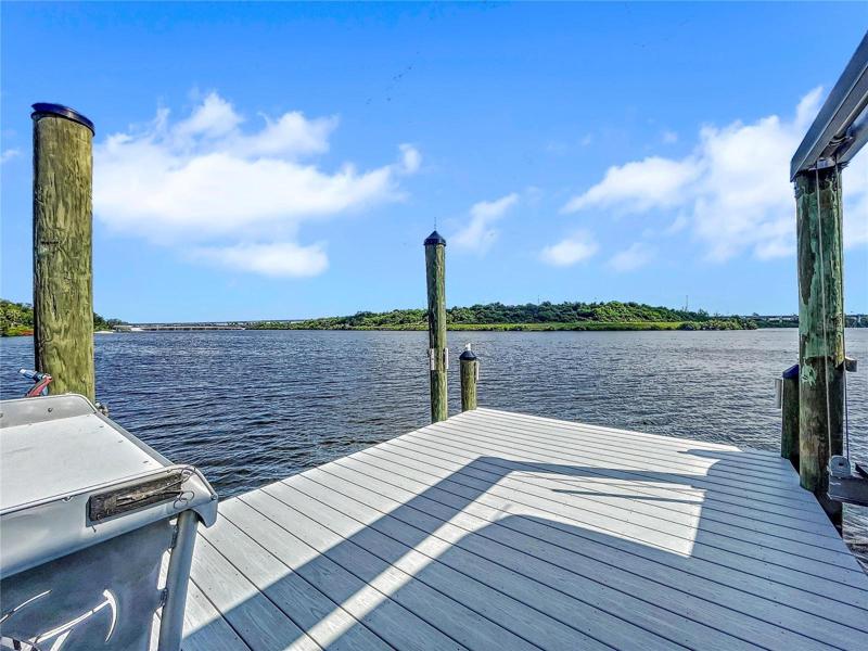 New composite decked dock and 14,000lb boat lift, Killer Dock fish cleaning table, water and electric.