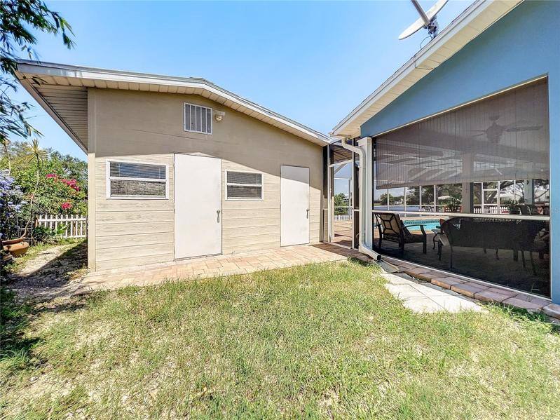 Door on the left goes to the air conditioned extra living space. Door on the right is a very large storage area.