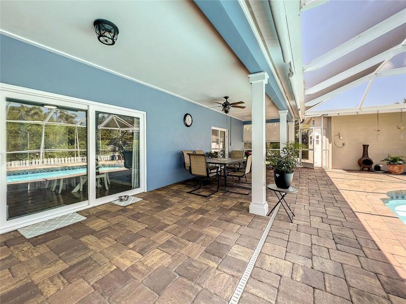 Sliding Doors to the Kitchen on the left and screen door to the right that goes to separate storage building and extra living space.