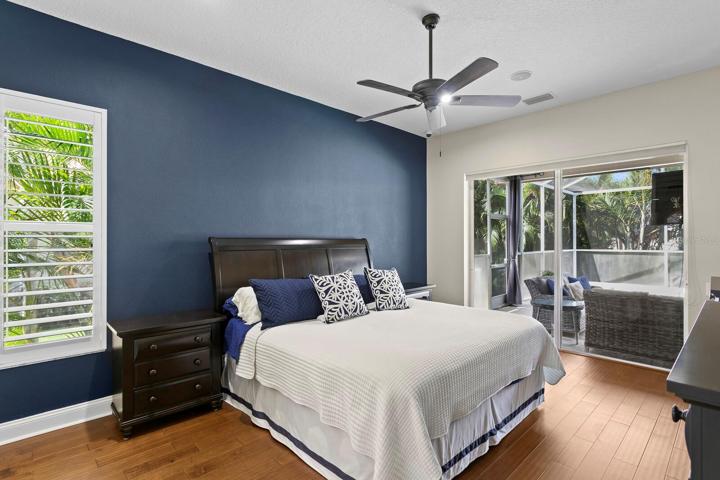 Spacious master suite with sliders out to the private pool