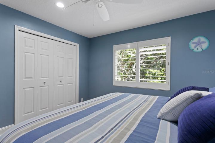 Great natural light and custom closet built-ins complete the 2nd bedroom