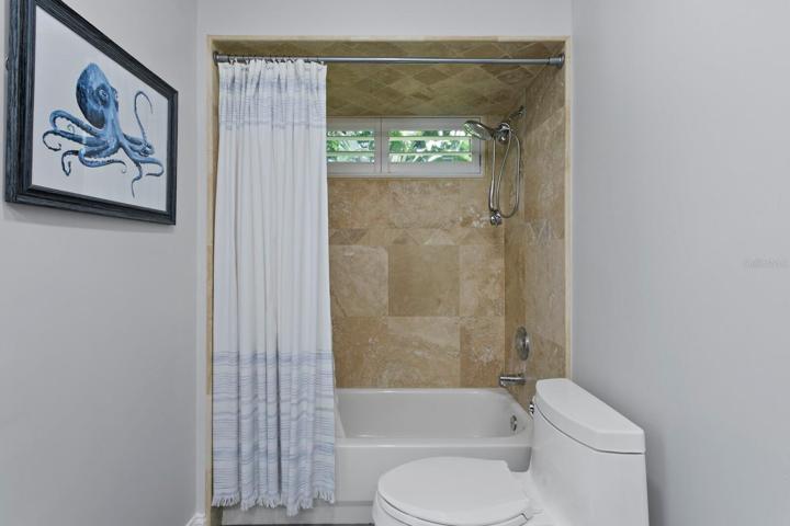 The laundry room has been completely renovated & includes a NEW washer & dryer