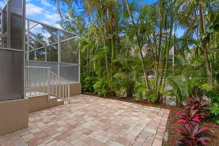 One of two outdoor pavered patio spaces