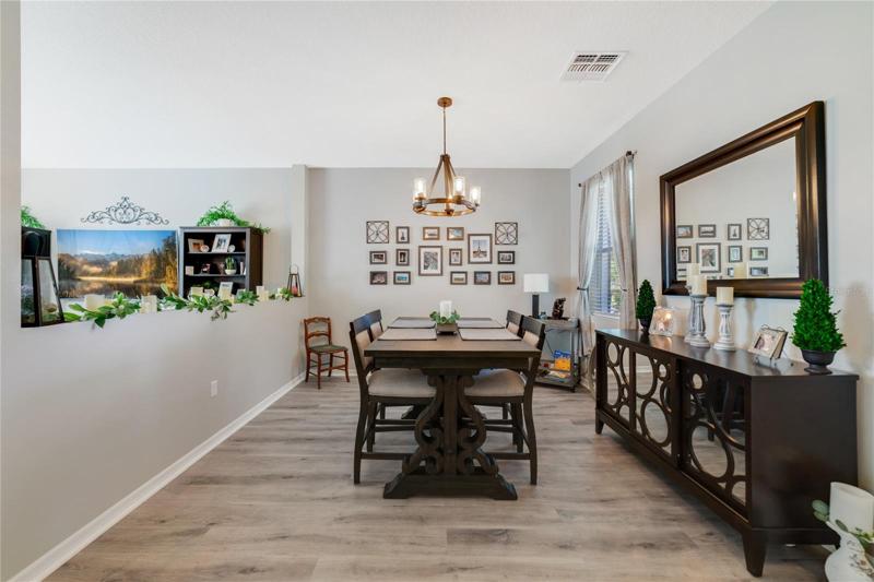 This 4BD/2.5BA home has a NEW A/C (2022), all NEW FLOORING throughout (Luxury Vinyl!), large open kitchen and a huge SCREENED LANAI with WOODED VIEWS!