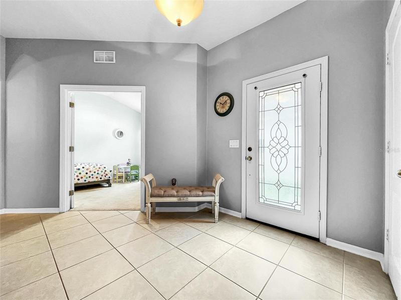 Foyer with glass etched inay front door