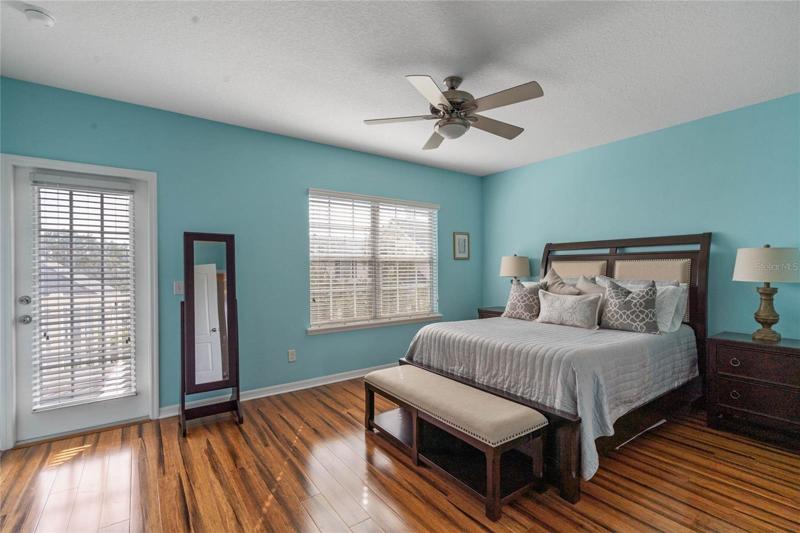 Master suite on the third floor with door to second covered balcony.