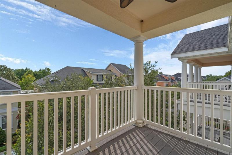 Second covered balcony off the master suite is a good spot for morning coffee and taking in the quaint views.
