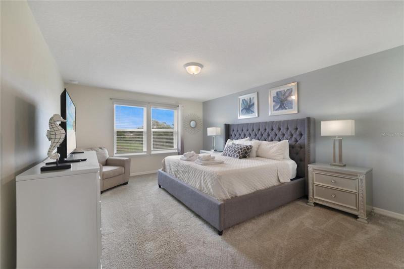 Your en-suite bedroom is a true retreat with a relaxing color palette of grays and blues, private bathroom and walk-in closet!