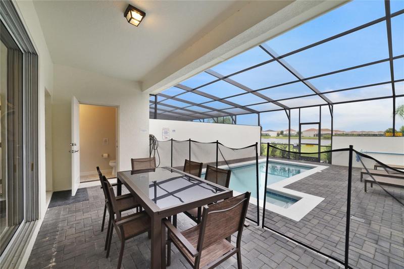 The COVERED LANAI and PAVER POOL DECK make it easy to spend the day at home splashing in the pool, completely SCREENED with POND VIEWS!